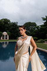 Exquisite ivory drape saree with floral accents, sparkling beads, and elegant bridal charm