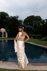 Exquisite ivory drape saree with floral accents, sparkling beads, and elegant bridal charm