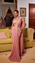 Exquisite pastel drape saree adorned with floral details, sparkling beads, and elegant bridal charm.