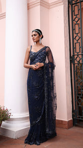 Exquisite Navy blue saree with sparkling floral details and intricate beadwork.