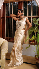 Exquisite ivory drape saree with floral accents, sparkling beads, and elegant bridal charm