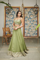 Green Net Sweetheart Neck Embellished And Woven Lehenga Set