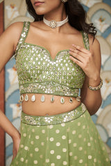 Green Net Sweetheart Neck Embellished And Woven Lehenga Set