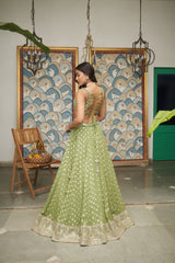 Green Net Sweetheart Neck Embellished And Woven Lehenga Set