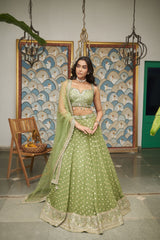 Green Net Sweetheart Neck Embellished And Woven Lehenga Set