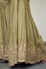 A sea green floral jaal adorned with delicate sequin embellishments.