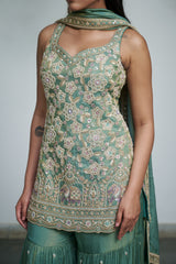 Sage green tissue with sequin, bead, resham & moti nature-inspired embellishments.