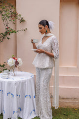 Exquisite pastel ivory peplum with floral detailing and sparkling beadwork from our bridal and bridesmaid collection.