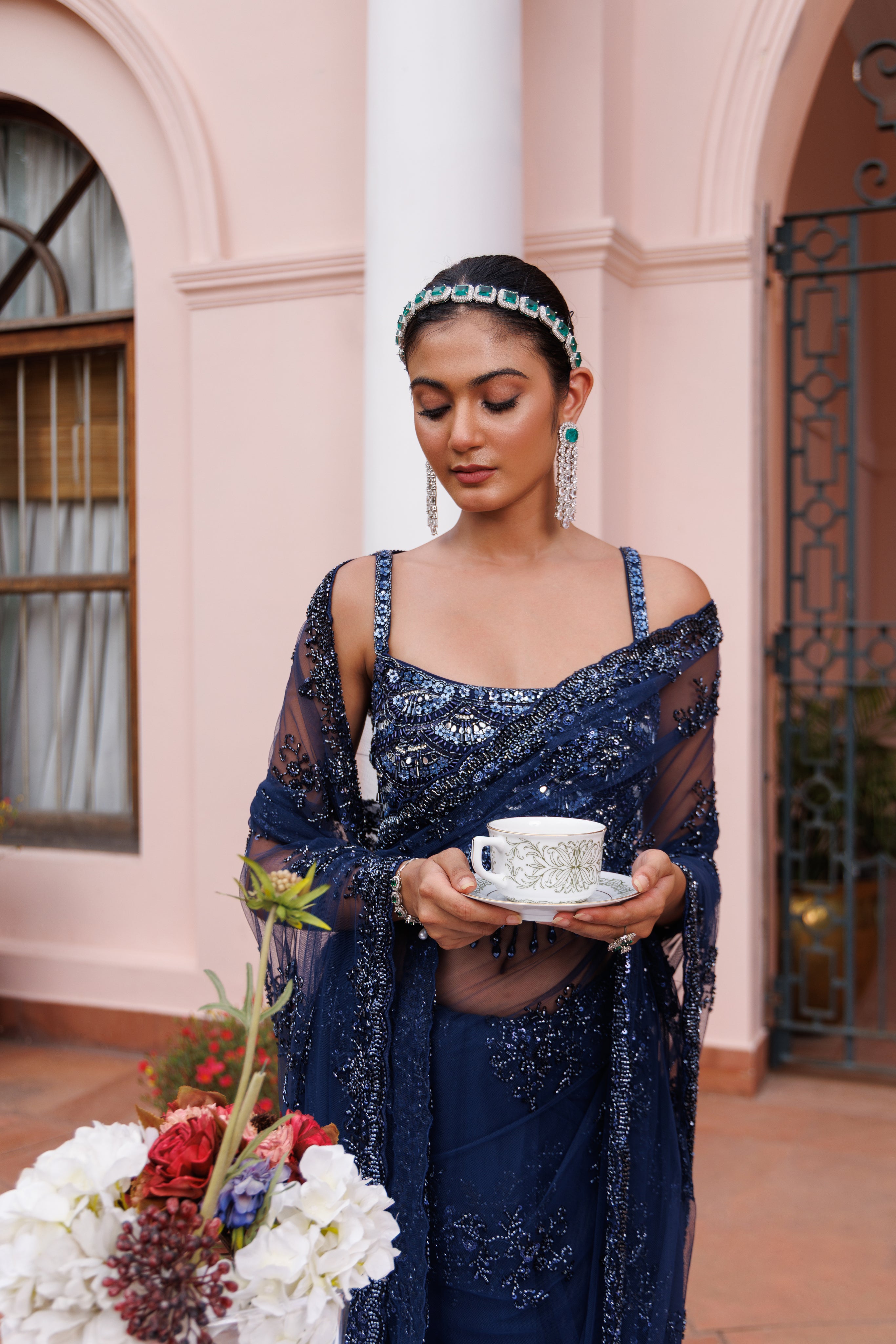 Exquisite Navy blue saree with sparkling floral details and intricate beadwork.