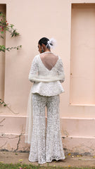Exquisite pastel ivory peplum with floral detailing and sparkling beadwork from our bridal and bridesmaid collection.