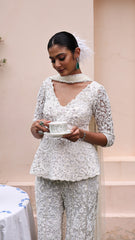 Exquisite pastel ivory peplum with floral detailing and sparkling beadwork from our bridal and bridesmaid collection.