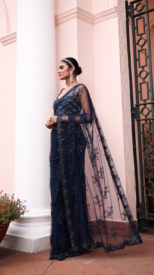 Exquisite Navy blue saree with sparkling floral details and intricate beadwork.