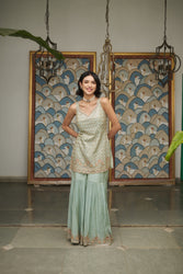 Ice blue tissue gharara with a honeybee jaal & sequin embellishments.