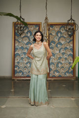 Ice blue tissue gharara with a honeybee jaal & sequin embellishments.