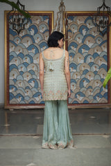 Ice blue tissue gharara with a honeybee jaal & sequin embellishments.