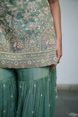 Sage green tissue with sequin, bead, resham & moti nature-inspired embellishments.