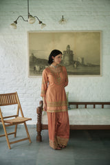 Rusty silk gharara set with sequin, zari & beadwork.